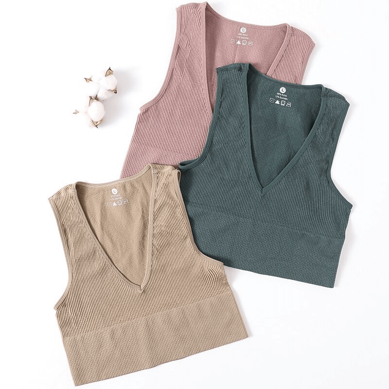 Three Women's Ribbed Seamless Tank Tops in beige, pink, and green, showcasing Deep V-neck style, perfect for yoga and running.